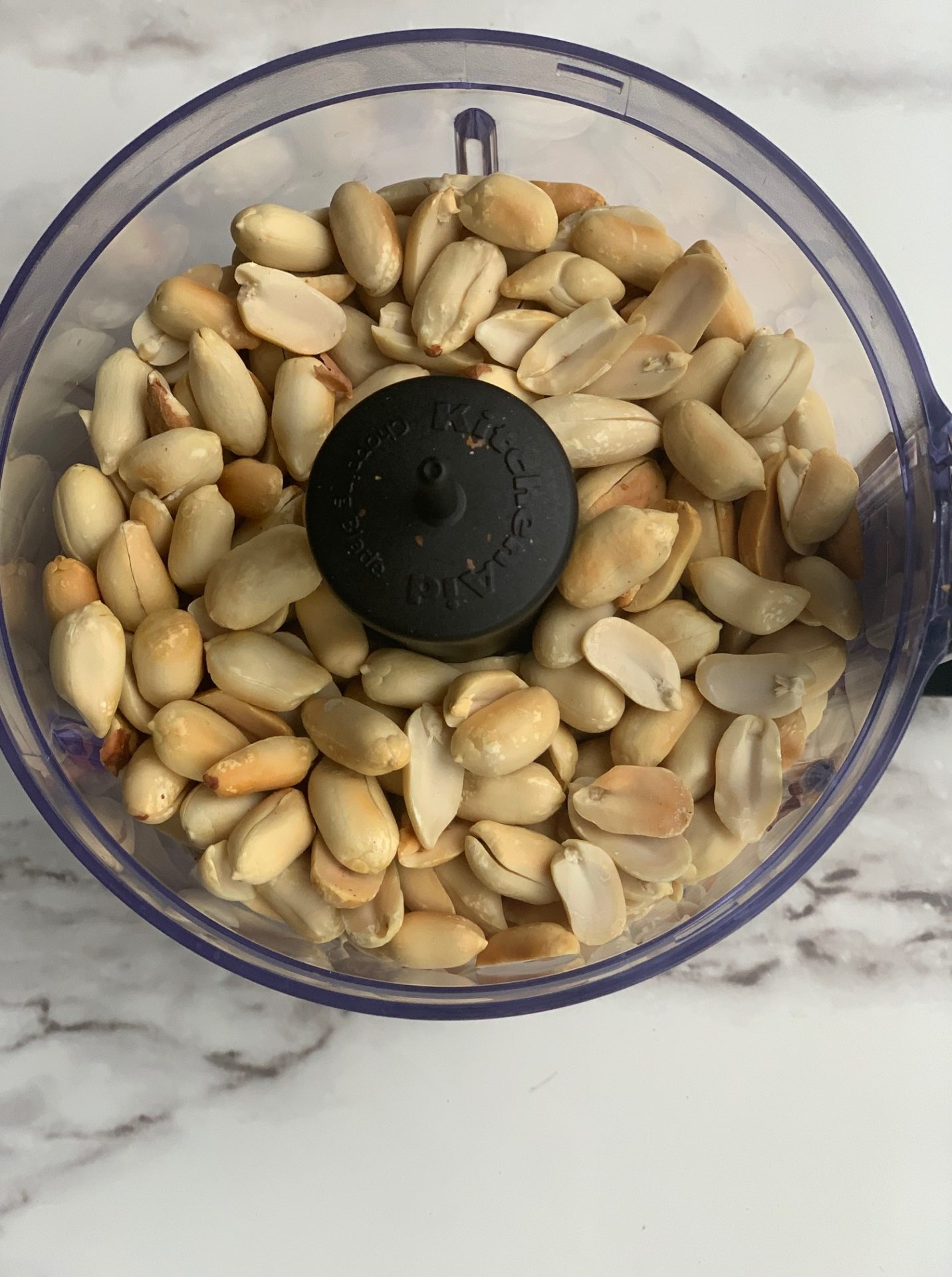 place roasted unsalted peanuts in food processor
